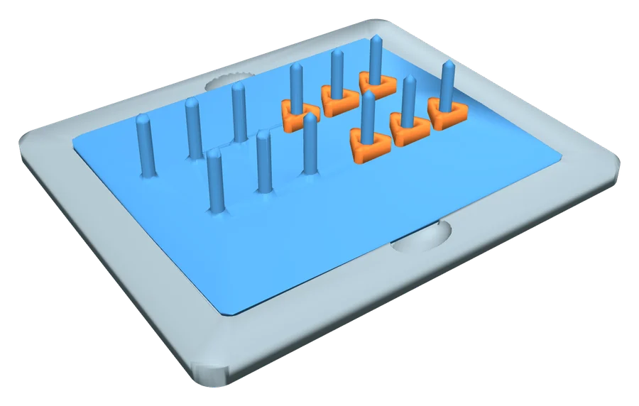 Peg transfer board in the task base, with six orange TPU rings on one side's pegs.